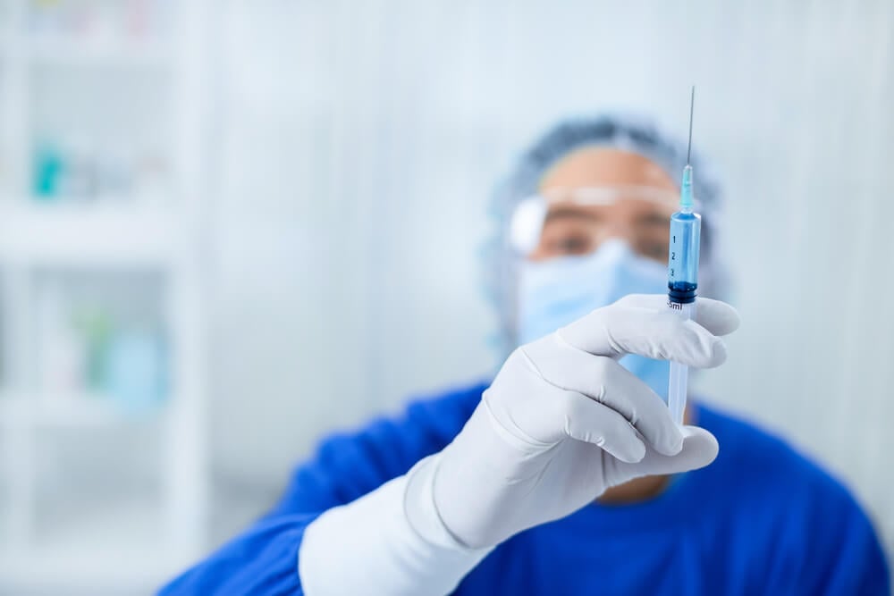 Anesthesiologist holding a syringe